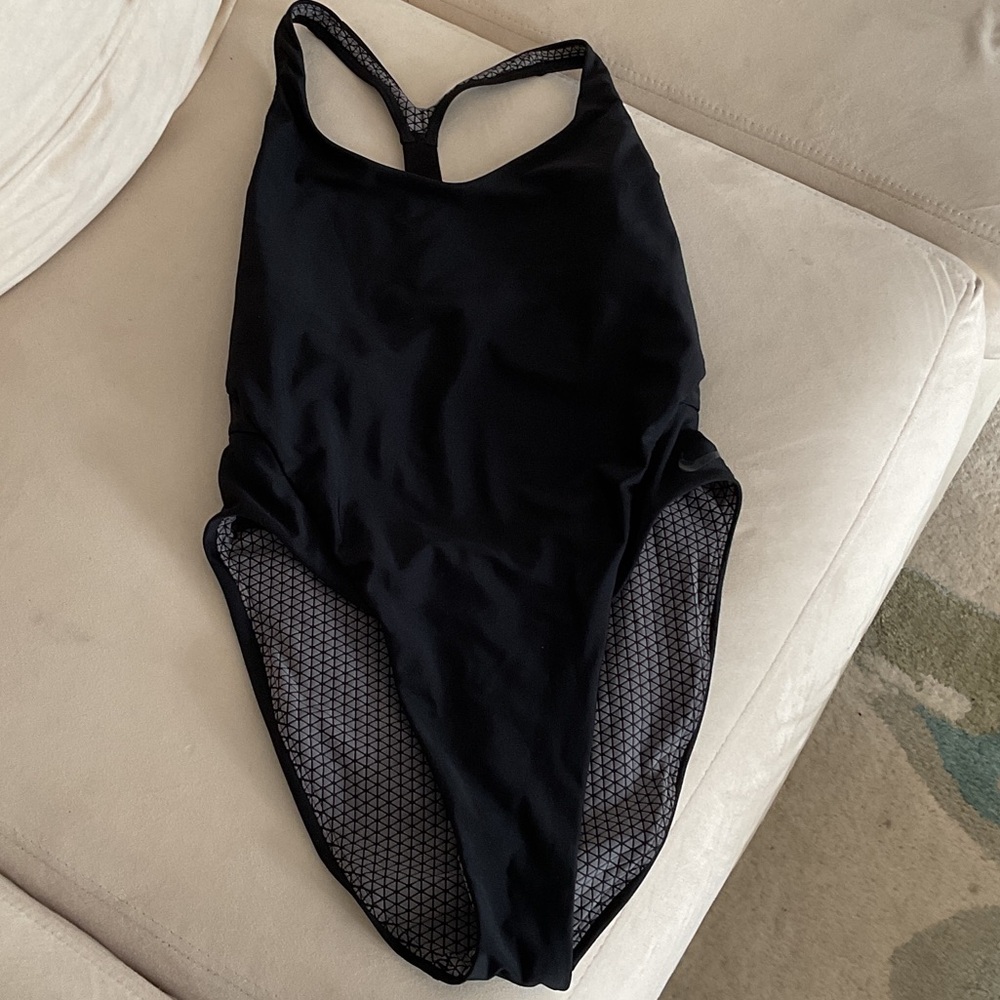 Nike swimwear one piece with racer back straps. Size medium. Never worn.